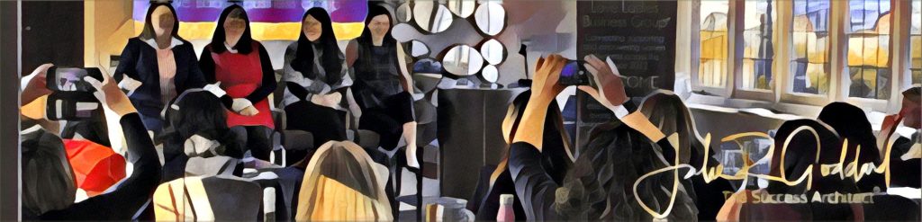 Julie Goddard speaking at IWD 2020, people taking pictures